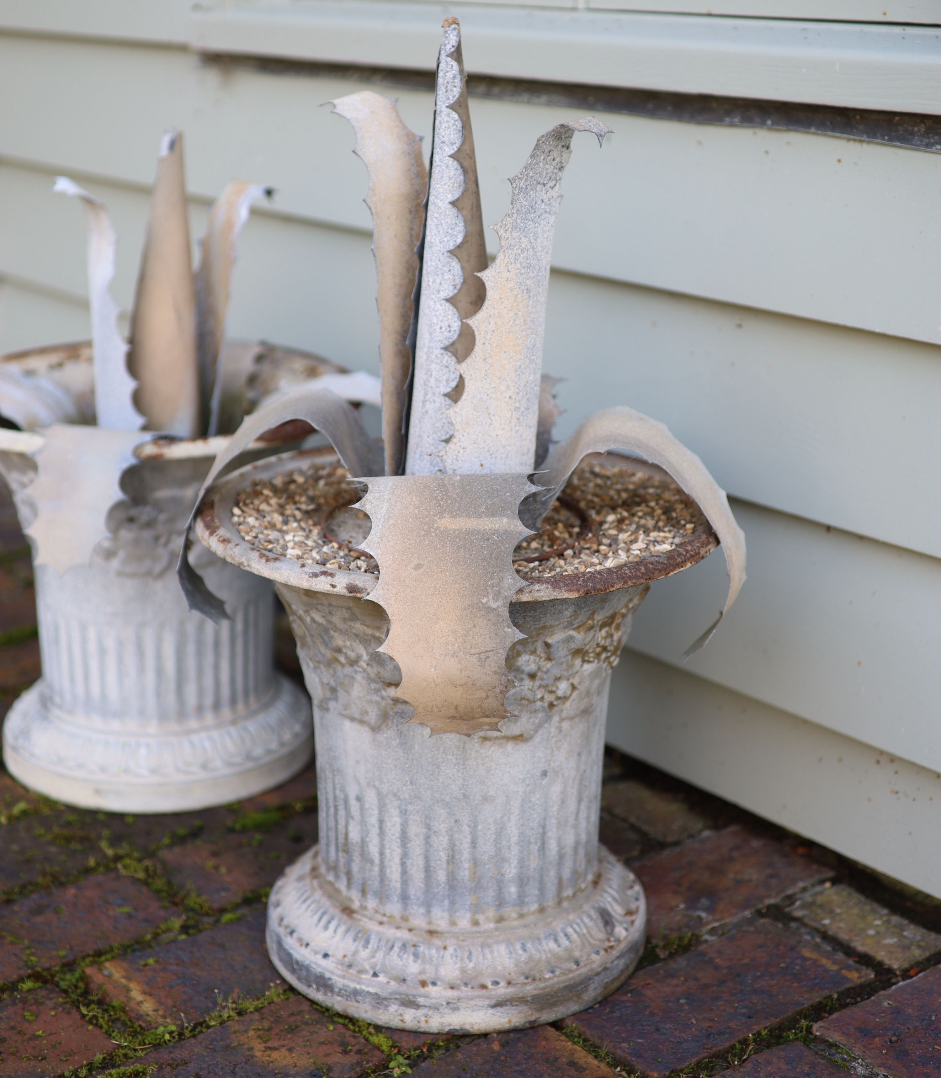 A pair of French galvanised tin aloe vera planters, height 64cm